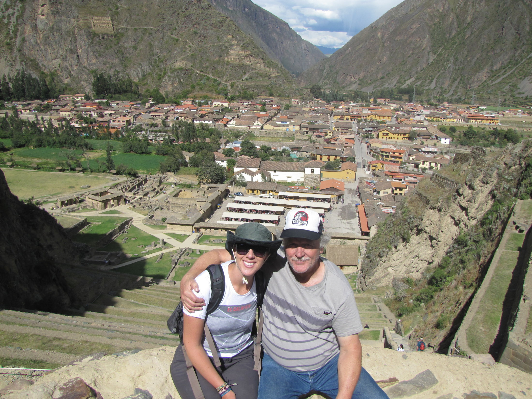 Shannon and her dad posing in front of Ollantaytambo