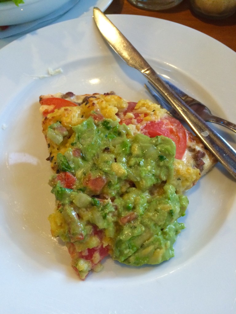 Pizza with avocado, tomato and sweet corn cake